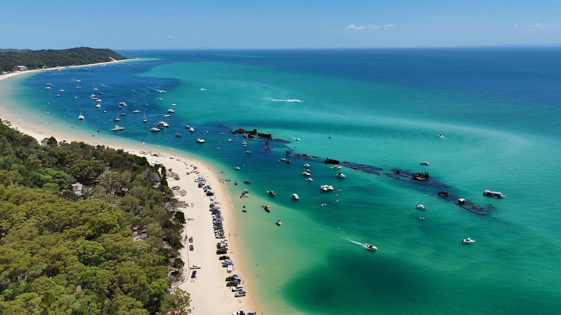 Aerial view of the Tangalooma Wrecks and turquoise water off Moreton Island, Queensland