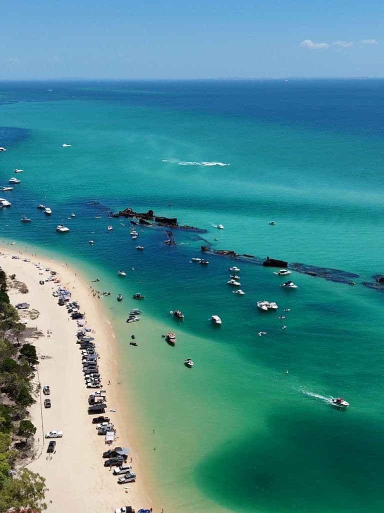 Aerial view of the Tangalooma Wrecks and turquoise water off Moreton Island, Queensland