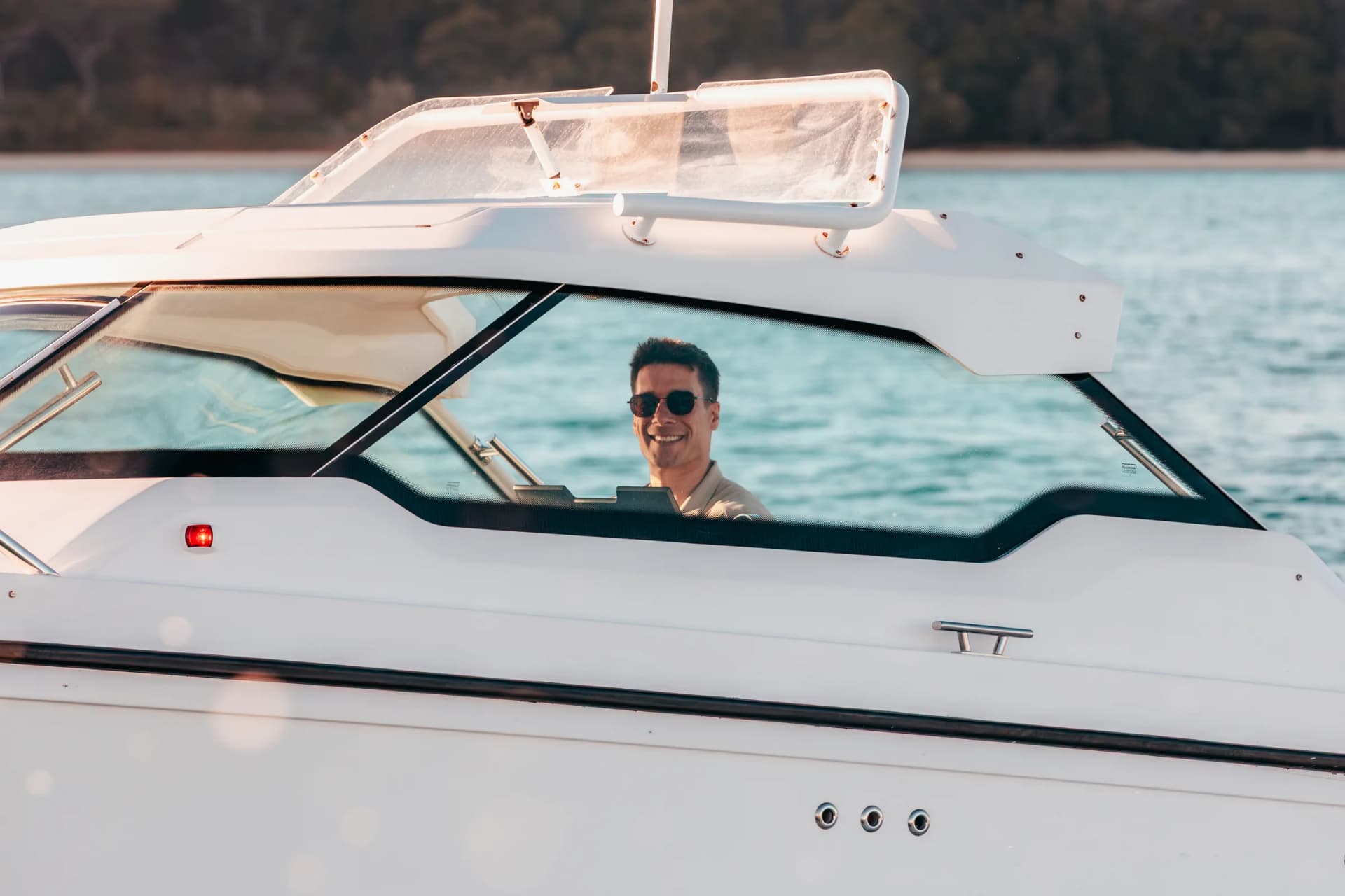 Captain Jeremy at the helm, seen through the windscreen