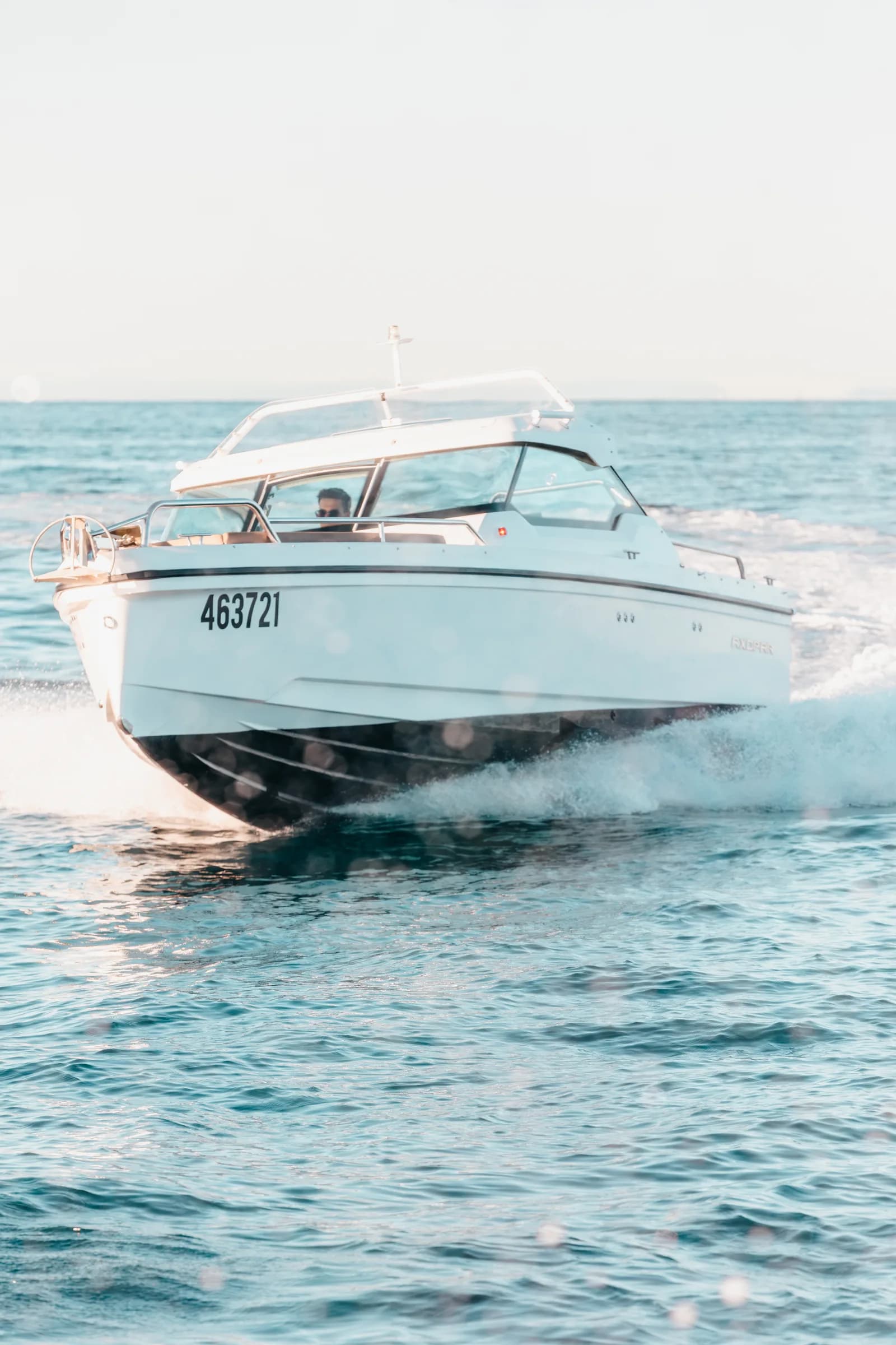 Axopar 24 HT bow on at speed on Moreton Bay, spray off the chines