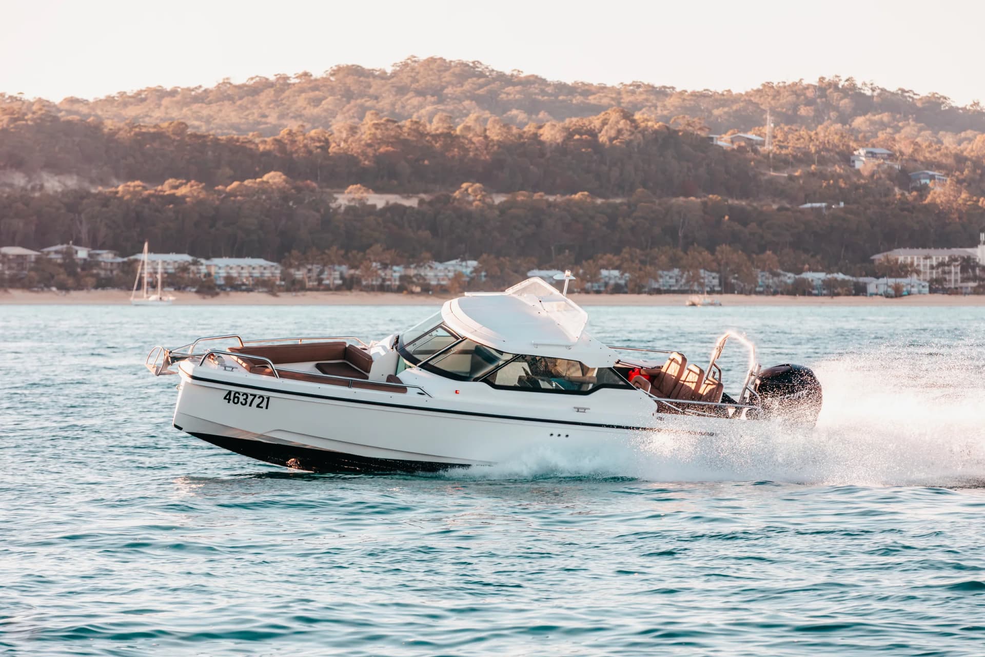 Sea La Vie in a turn off the Moreton Bay coast, houses on the hill behind