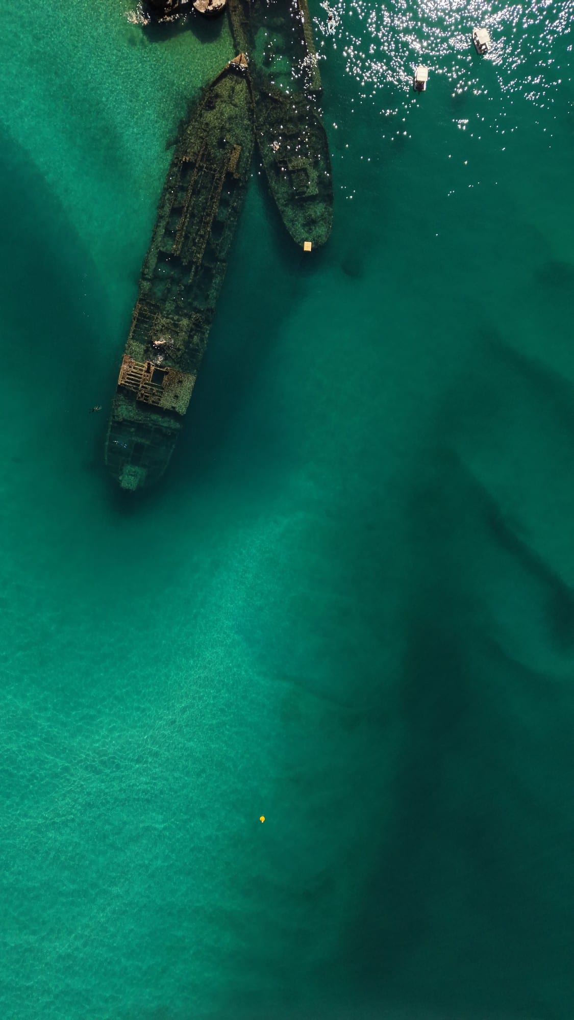 Drone view of the Tangalooma wreck line in turquoise water off Moreton Island